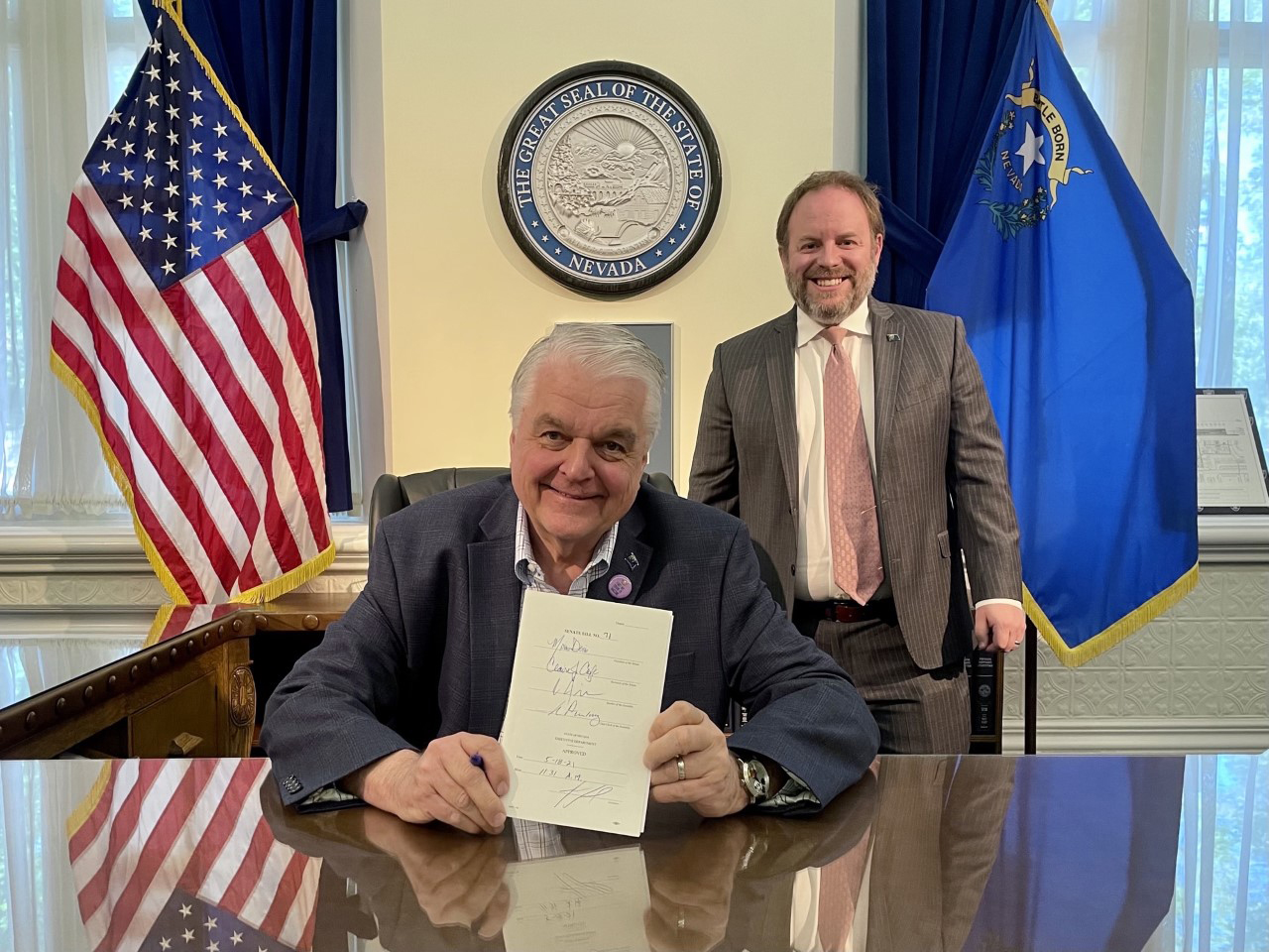 Governor Sisolak Signing SB 71 with Treasurer Zach Conine Photo 3